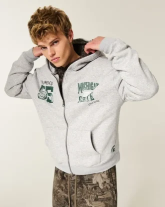 Boxy Zip-Up Michigan State University Spartans -grafiikkahuppari Boxy Zip-Up Michigan State University Spartans -grafiikkahuppari