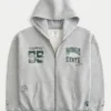 Boxy Zip-Up Michigan State University Spartans -grafiikkahuppari Boxy Zip-Up Michigan State University Spartans -grafiikkahuppari