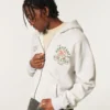 Boxy Zip-Up University of Miami Hurricanes -grafiikkahuppari Boxy Zip-Up University of Miami Hurricanes -grafiikkahuppari