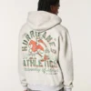 Boxy Zip-Up University of Miami Hurricanes -grafiikkahuppari Boxy Zip-Up University of Miami Hurricanes -grafiikkahuppari