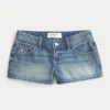 Erittäin matala vyötärö, keskipitkä pesu, kukkakirjailtu denim-minishortsit Erittäin matala vyötärö, keskipitkä pesu, kukkakirjailtu denim-minishortsit