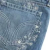 Erittäin matala vyötärö, keskipitkä pesu, kukkakirjailtu denim-minishortsit Erittäin matala vyötärö, keskipitkä pesu, kukkakirjailtu denim-minishortsit