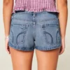 Erittäin matala vyötärö, kulunut keskipitkä pesu, denim-minishortsit Erittäin matala vyötärö, kulunut keskipitkä pesu, denim-minishortsit