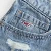 Erittäin matalat brodeeratut denim-minishortsit Erittäin matalat brodeeratut denim-minishortsit