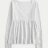 Helppo pitkähihainen Pointelle-babydoll-toppi