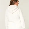 Holiday Vault Release Sherpa-vuorattu vetoketjullinen logopaita Holiday Vault Release Sherpa-vuorattu vetoketjullinen logopaita
