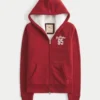 Holiday Vault Release Sherpa-vuorattu vetoketjullinen logopaita Holiday Vault Release Sherpa-vuorattu vetoketjullinen logopaita