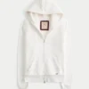 Holiday Vault Release Sherpa-vuorattu vetoketjullinen logopaita Holiday Vault Release Sherpa-vuorattu vetoketjullinen logopaita