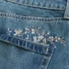 Keskikokoinen pesu Brodeerattu denim-minihame Keskikokoinen pesu Brodeerattu denim-minihame
