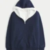 Käännettävä, tekoturkilla vuorattu fleece-huppari vetoketjulla Käännettävä, tekoturkilla vuorattu fleece-huppari vetoketjulla