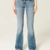 Matala vyötärö, kulunut, keskipitkä pesu, bootcut-farkut Matala vyötärö, kulunut, keskipitkä pesu, bootcut-farkut