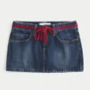 Matala vyötärö, solmittava denim-minihame Matala vyötärö, solmittava denim-minihame