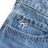 Matala vyötäröinen brodeerattu denim-minihame Matala vyötäröinen brodeerattu denim-minihame