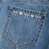 Matala vyötäröinen brodeerattu denim-minihame Matala vyötäröinen brodeerattu denim-minihame