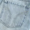 Matala vyötäröinen denim-minihame Matala vyötäröinen denim-minihame