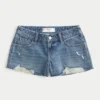 Matala vyötäröinen, kulutettu, keskipitkä pesu denim-minishortsit Matala vyötäröinen, kulutettu, keskipitkä pesu denim-minishortsit
