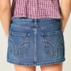 Matala vyötäröinen nastoitettu denim-minihame Matala vyötäröinen nastoitettu denim-minihame
