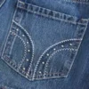 Matala vyötäröinen nastoitettu denim-minihame Matala vyötäröinen nastoitettu denim-minihame