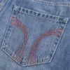Matala vyötäröinen punainen ommeltu denim-minihame Matala vyötäröinen punainen ommeltu denim-minihame