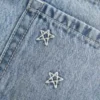 Matala vyötäröinen tähtikirjailtu denim-minihame Matala vyötäröinen tähtikirjailtu denim-minihame