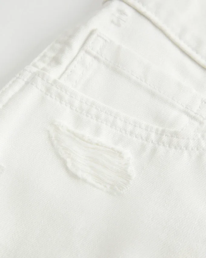 Matala vyötäröiset kuluneet valkoiset denim-minishortsit Matala vyötäröiset kuluneet valkoiset denim-minishortsit