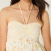 Olkaimeton röyhelöinen babydoll-minimekko Olkaimeton röyhelöinen babydoll-minimekko