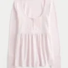 Pitkähihainen Henley-babydoll-toppi Pitkähihainen Henley-babydoll-toppi