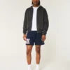 Polvipituiset fleece-shortsit, joissa UConn Huskies -grafiikka Polvipituiset fleece-shortsit, joissa UConn Huskies -grafiikka