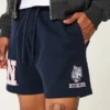 Polvipituiset fleece-shortsit, joissa UConn Huskies -grafiikka Polvipituiset fleece-shortsit, joissa UConn Huskies -grafiikka
